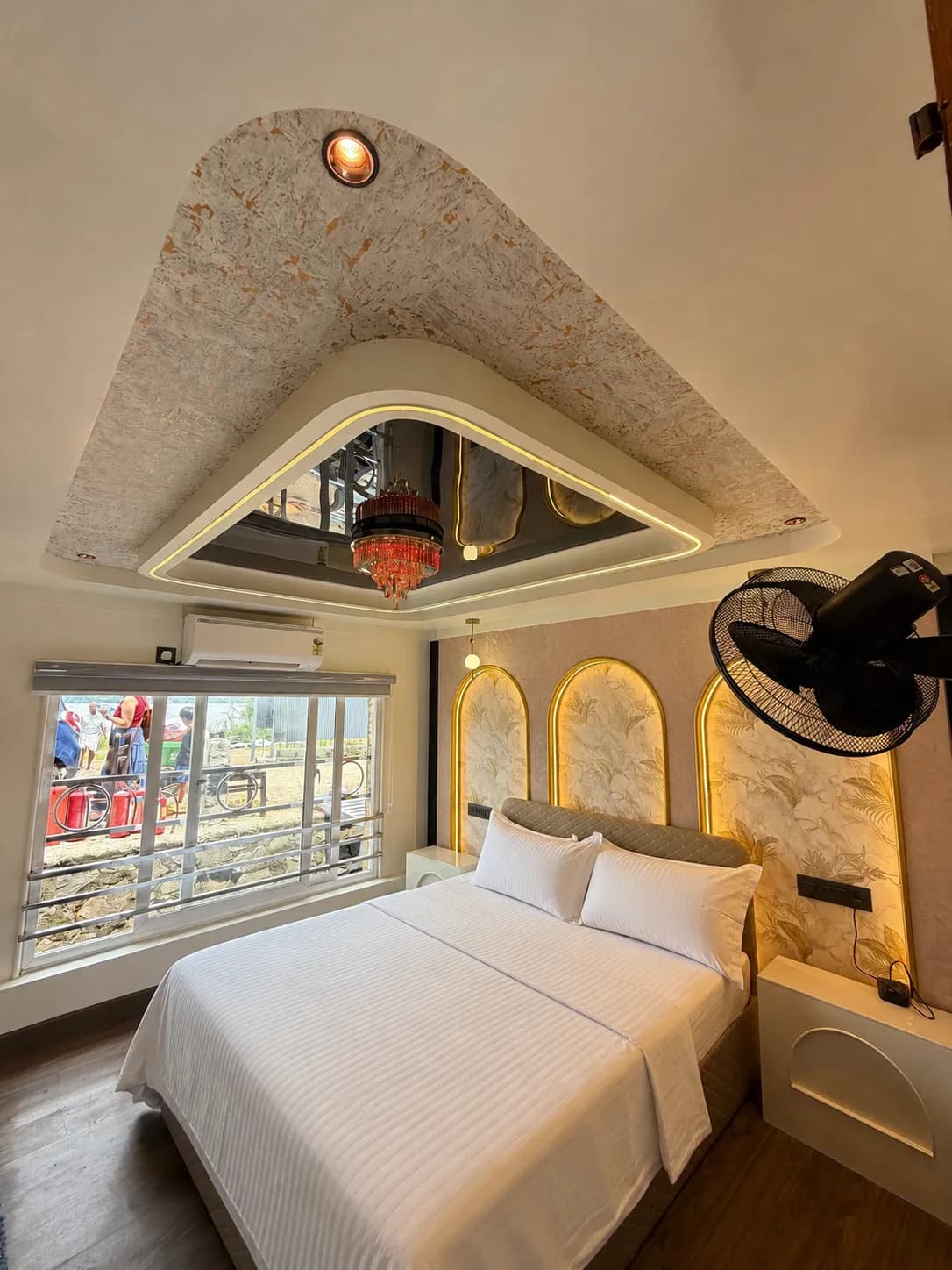 First air-conditioned premium bedroom interior of Mahadeva houseboat with wooden accents