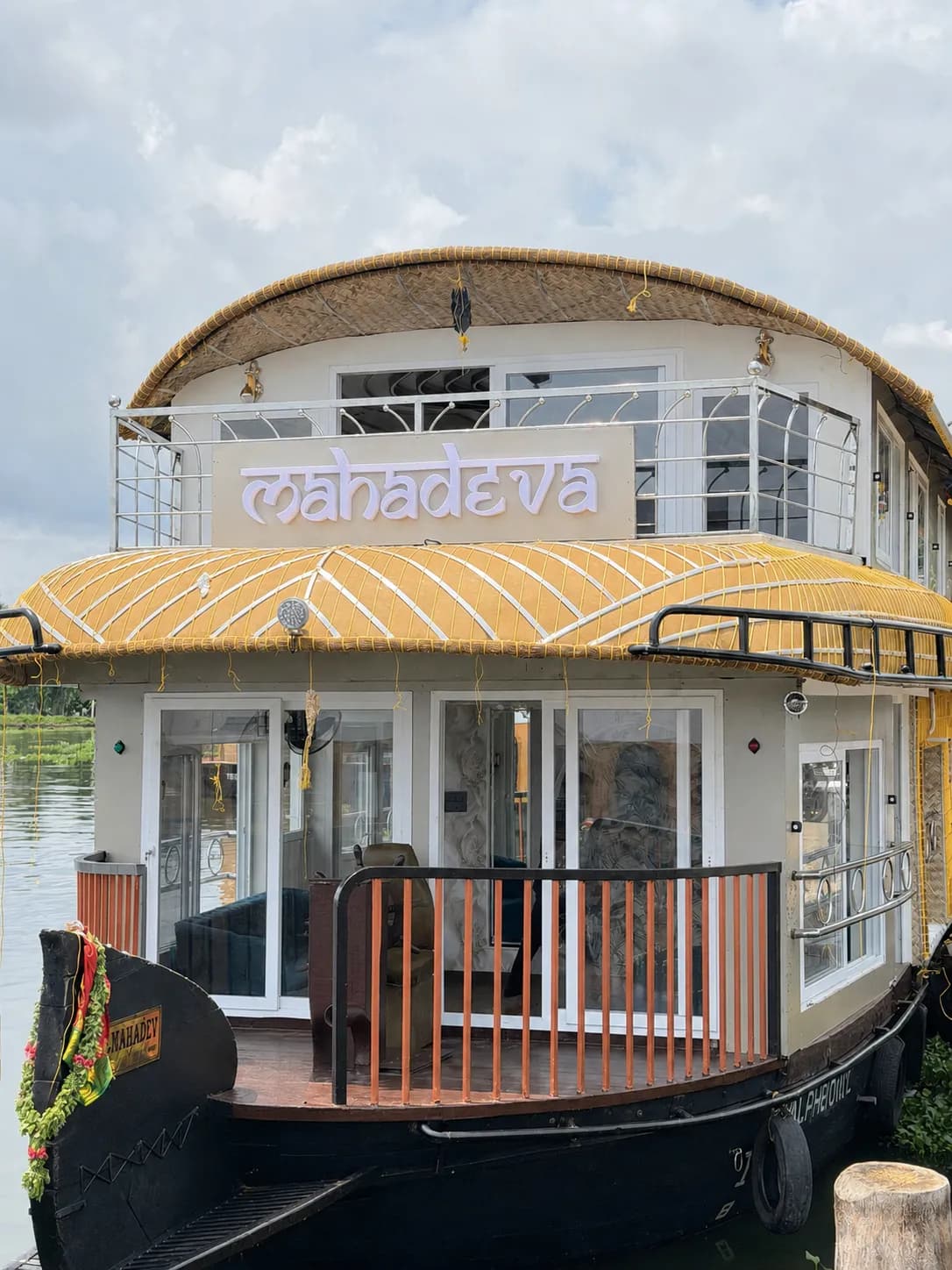 Close-up of the front nameplate of Mahadeva premium houseboat