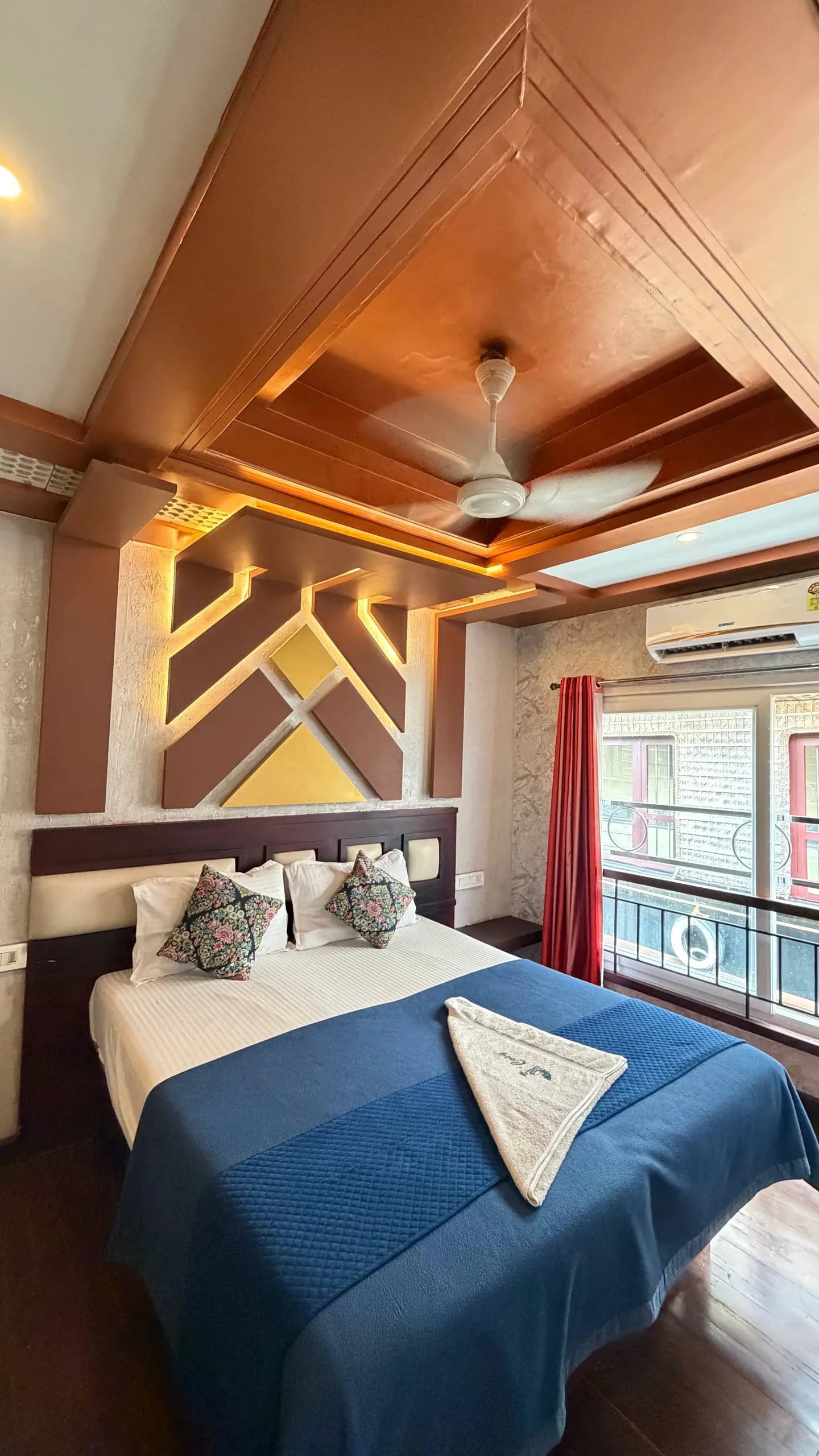 Premium air-conditioned bedroom interior of Vinayaka houseboat with traditional Kerala decor